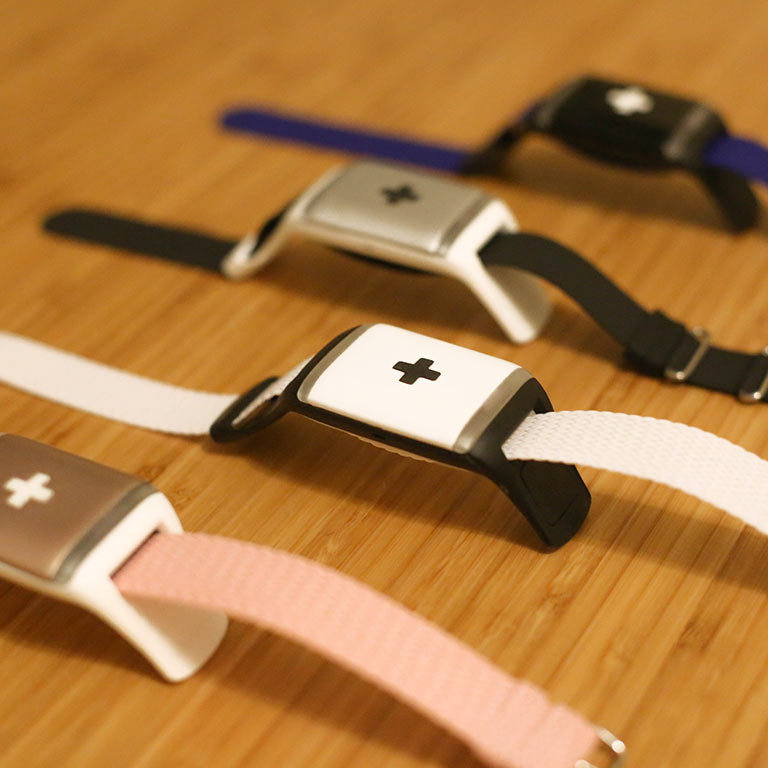 A close-up of CareBand bracelets with wearable sensors to monitor movement and daily activity.